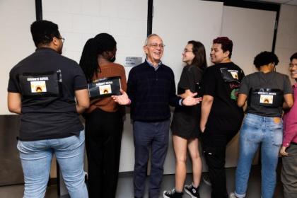 Students surprise President Reif with farewell signs at MIT dance party