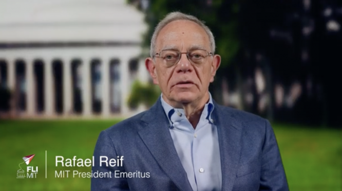 Rafael Reif with a classical columned building in the background.